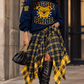 WRAPPED IN PLAID SKIRT